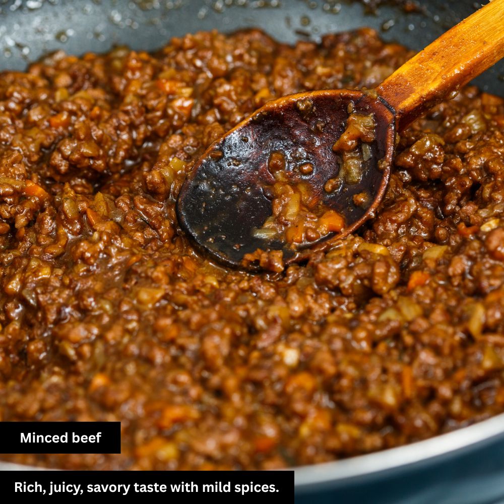 Close-up of juicy, tasty minced beef in the final stage of preparation, sizzling with rich flavor.