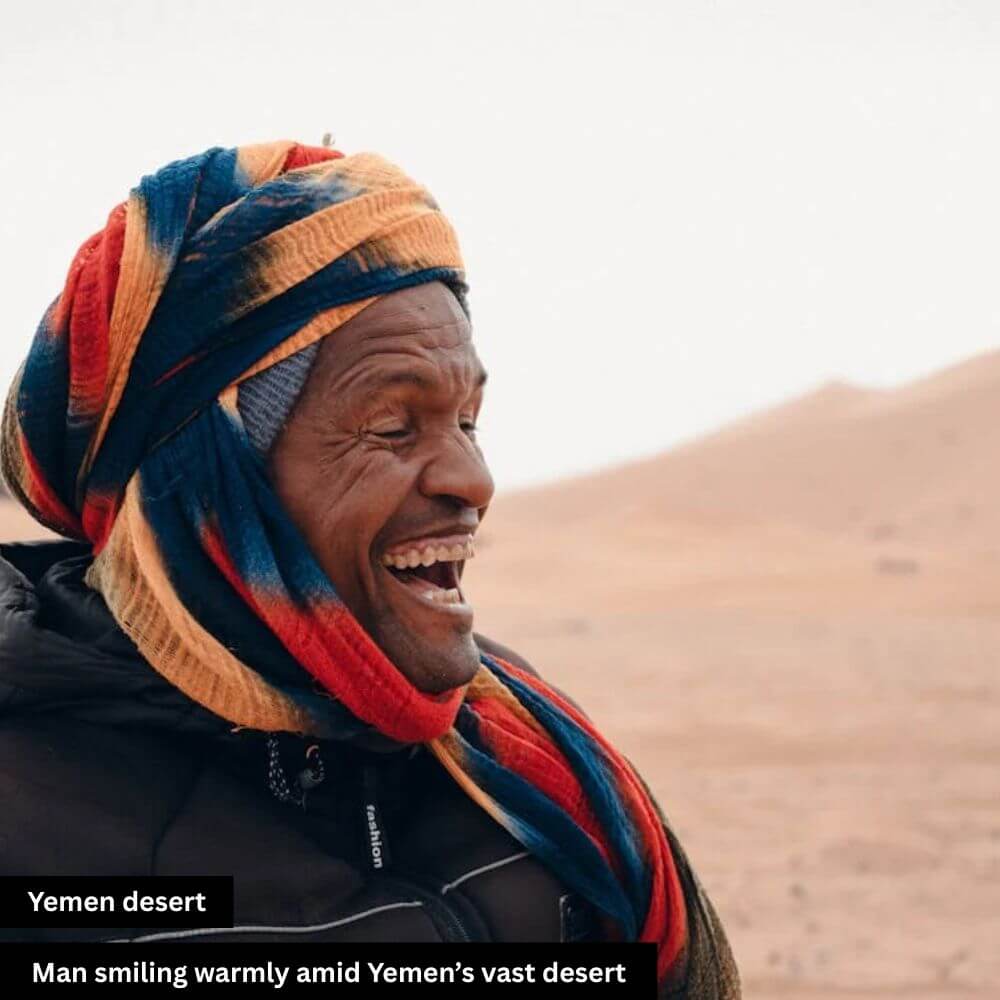 man smiling warmly Yemen desert