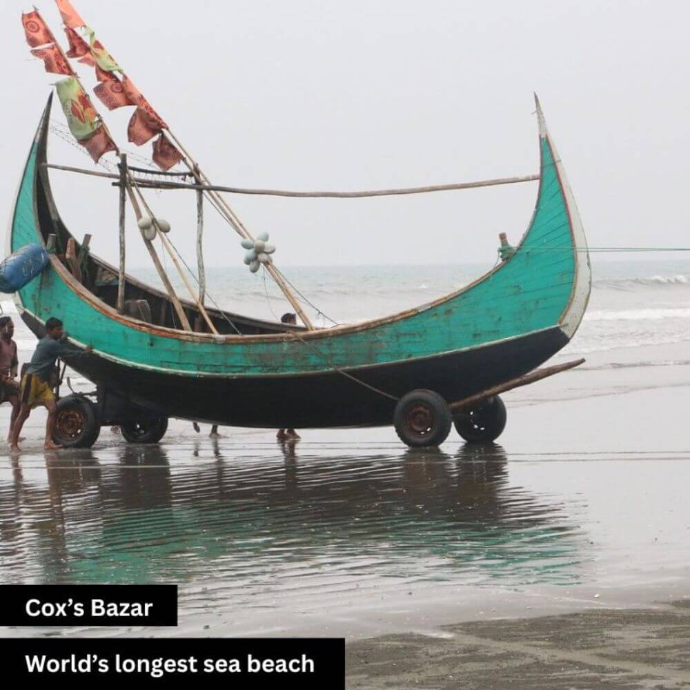A breathtaking view of Cox’s Bazar, the world’s longest natural sea beach in Bangladesh. Gentle waves roll across the vast shoreline under the open sky. Visitors stroll along the sandy coast, enjoying the serene beauty of the beach